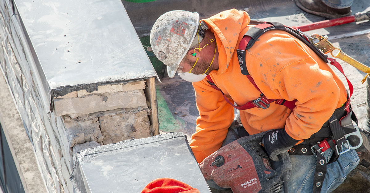 Using designated areas as fall protection on flat roofs