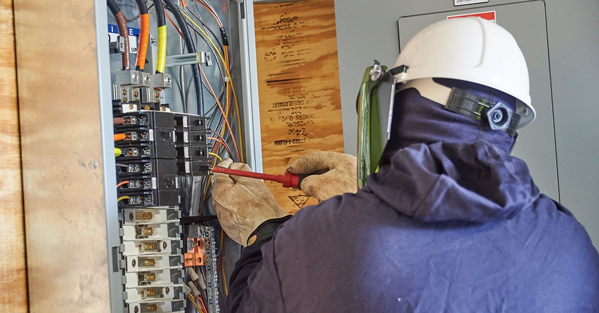 person working on electrical box