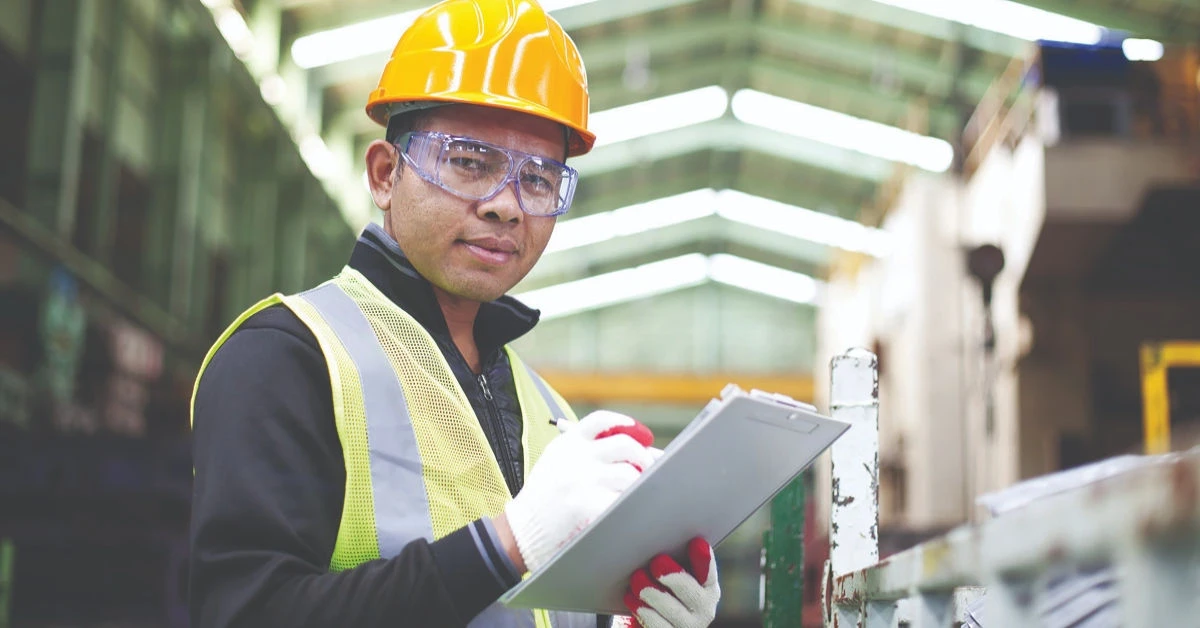OSHA inspector wearing hard hat in the workplace