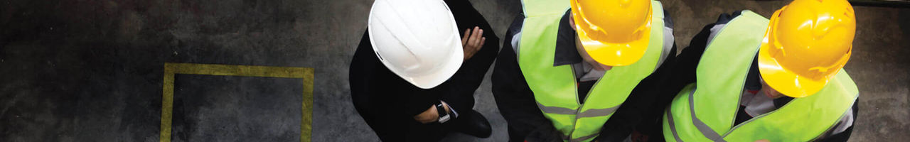Aerial View of 3 men in hard hats and safety vests