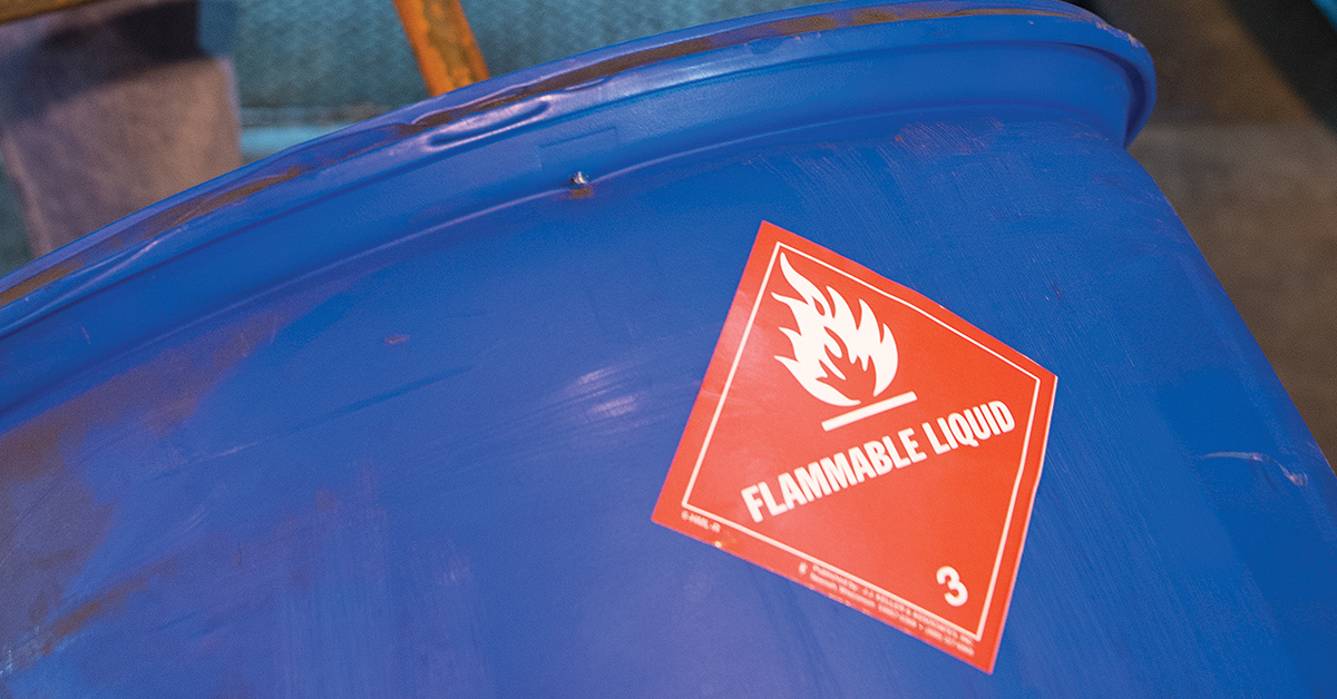 Container with red flammable liquid label