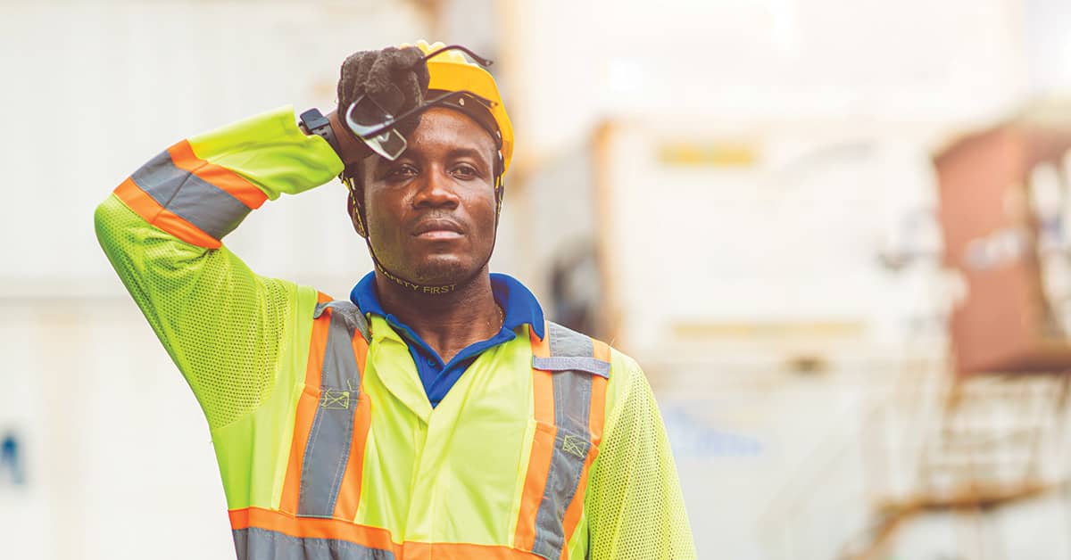 Tired worker sweating from hot weather in summer