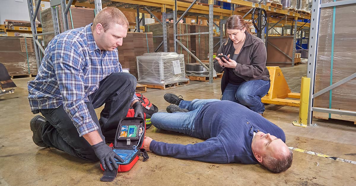 Rendering first aid to an injured worker in warehouse setting