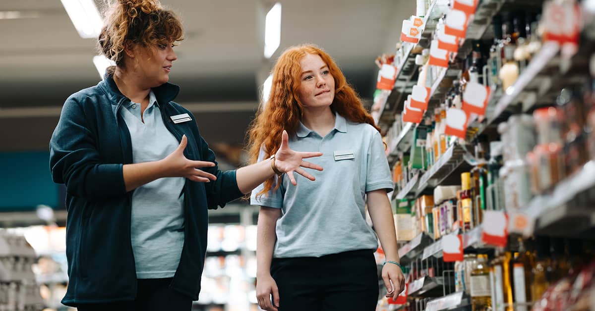 Teen worker in training in retail setting